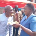Lugari MP Nabii Nabwera being fed cake by his wife Daisy Nyongesa during his birthday celebration on November 14, 2024, surrounded by family, friends, and supporters.